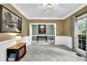 Elegant living room with tile floors, decorative molding, and bright natural light at 842 Laurel Crest Sw Ct, Marietta, GA 30064