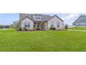 Beautiful single-story home featuring a well-maintained front yard and appealing architectural design at 112 Leveret Rd, Locust Grove, GA 30248