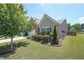 Well-maintained home with lush landscaping, showcasing its curb appeal and charm at 2209 Cedar Place Ct, Snellville, GA 30078