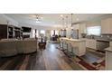 Open concept living space with a modern kitchen, dining area, and cozy living room at 2209 Cedar Place Ct, Snellville, GA 30078