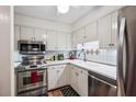Functional kitchen featuring stainless steel appliances and ample cabinet space at 4620 Wieuca Ne Rd # 42, Atlanta, GA 30342