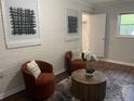 Inviting living room with decorative pillows, accent chairs, and modern artwork at 2135 Niskey Lake Sw Rd, Atlanta, GA 30331