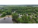 Expansive aerial view of a neighborhood, showcasing lush greenery, and lake views at 2548 Lakeview East Se Trl, Atlanta, GA 30316