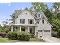 Beautiful two-story home with a covered porch, and a two-car garage at 2548 Lakeview East Se Trl, Atlanta, GA 30316