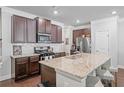 Well-equipped kitchen featuring stainless steel appliances, granite countertops, and ample storage at 221 Irwell Path, Lawrenceville, GA 30044