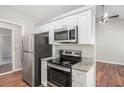 Updated kitchen with granite countertops, stainless steel appliances, and modern cabinetry at 9188 Jefferson Village Sw Dr, Covington, GA 30014