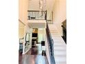 Grand foyer with soaring ceilings, hardwood floors, and staircase at 1345 Starboard Way, Cumming, GA 30041