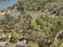 Expansive aerial view of a lakeside community surrounded by lush greenery and serene water at 2270 Emerald Dr, Jonesboro, GA 30236