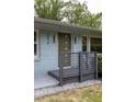Close-up of the home's stylish entrance with a modern door and gray porch at 2274 Edgemore Se Dr, Atlanta, GA 30316