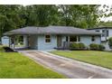 Inviting home with covered parking, fresh landscaping, and a well-manicured lawn at 2274 Edgemore Se Dr, Atlanta, GA 30316