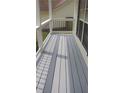 Enjoy outdoor living on this cozy porch with neutral color palette and stylish railings at 2477 Briar Valley Way, Dacula, GA 30019