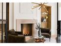 Inviting living room featuring a fireplace, modern lighting, and comfortable seating at 490 Mount Paran Rd, Atlanta, GA 30327