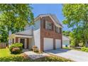 Inviting two-story brick home with a two-car garage and walkway at 4915 Truitt Ln, Decatur, GA 30035