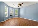 Bedroom with ample light from a bay of windows and wood floors at 2465 Brianna Dr, Hampton, GA 30228