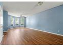 Large living room featuring wood floors and a bay of windows at 2465 Brianna Dr, Hampton, GA 30228