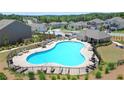 Large community pool with plenty of lounge chairs for relaxing in the sun at 688 Saffron Blvd, Lawrenceville, GA 30045