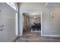 Dining room with hardwood floors, dark wood furniture, chandelier and neutral wall colors at 3186 Sail Winds Nw Dr, Acworth, GA 30101