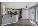 Eat-in kitchen with stainless appliances, white cabinetry and granite countertops at 3186 Sail Winds Nw Dr, Acworth, GA 30101