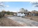 Charming home with covered parking, driveway and a welcoming front porch at 4605 Doss Cir, Powder Springs, GA 30127