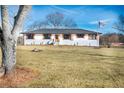 Well-maintained home with a manicured lawn and inviting front entrance with lovely shutters at 3241 Broadnax Mill Rd, Loganville, GA 30052