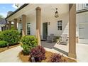Relaxing covered porch with stylish seating and decorative lighting at 3525 Brynhurst Dr, Cumming, GA 30028