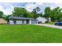 A nicely lawn complements this single-story home with an attached garage and neighboring home at 1451 Brays Mill Trce, Lawrenceville, GA 30044