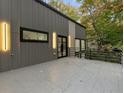 Cantilevered patio overlooking the wooded lot and the modern standing seam exterior at 1153 Dawn View Nw Ln, Atlanta, GA 30327