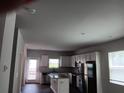 Kitchen features white cabinets, stainless steel appliances, granite countertops, and a center island at 3242 Cascade Parc Sw Blvd, Atlanta, GA 30311