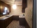 Traditional kitchen with white appliances, and wood cabinets at 5927 Sherrie Ln, Powder Springs, GA 30127