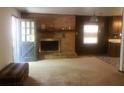 Living room with a brick fireplace at 5927 Sherrie Ln, Powder Springs, GA 30127