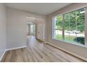 Open floor plan with hardwood floors, archway and a large window at 6170 Winston Trce, Mcdonough, GA 30252