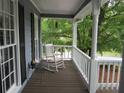 Cozy covered porch with rocking chair, perfect for relaxing and enjoying the outdoors at 27 Edgar Ct, Hiram, GA 30141