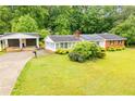 Property with a detached garage and long driveway at 336 Burnt Hickory Rd, Powder Springs, GA 30127