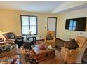 Cozy living room with a large window and comfortable seating arrangements at 162 Apple Valley Dr, Woodstock, GA 30188