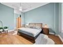 Cozy main bedroom with hardwood floors, a ceiling fan and ample natural light at 3820 Roswell Ne Rd # 705, Atlanta, GA 30342