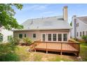 Exterior view of back of the house and the wooden deck, perfect for outdoor entertaining at 4481 Mccart Cv, Stone Mountain, GA 30083