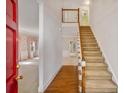 Bright foyer with hardwood floors, stairway to second level, and adjacent rooms at 4481 Mccart Cv, Stone Mountain, GA 30083