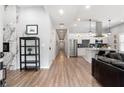 Bright, open-concept living space with modern finishes and eat-in kitchen featuring stainless appliances at 991 Metropolitan Sw Pkwy, Atlanta, GA 30310