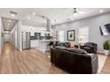 Inviting living room featuring an eat-in kitchen, contemporary furniture, and ample natural light at 991 Metropolitan Sw Pkwy, Atlanta, GA 30310