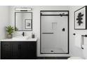 Modern bathroom with black framed glass shower, dark vanity, and white subway tile at 4011 Redan Rd # 9, Stone Mountain, GA 30083