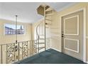 Spiral staircase on upper level with metal railings and view of the outside at 6851 Ne Roswell Rd # C4, Atlanta, GA 30328