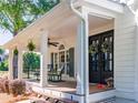 Inviting front porch with comfortable seating, decorative wreaths, and charming welcome decor at 10635 Sugar Crest Ave, Johns Creek, GA 30097
