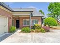 Charming brick home with well-maintained landscaping, inviting front entrance, and a clean, modern aesthetic at 2703 Brookhavenrun Cir, Duluth, GA 30097