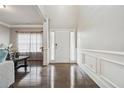 Elegant entryway with hardwood flooring, white wainscoting, and ample natural light at 3670 Casual Ridge Way, Loganville, GA 30052