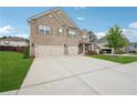 Attractive two-story brick house with a spacious driveway and a manicured lawn at 3670 Casual Ridge Way, Loganville, GA 30052