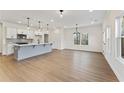 Spacious living area with hardwood floors, recessed lighting, and abundant natural light at 401 Carrera Ln, Acworth, GA 30102