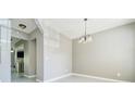 Dining room with modern flooring, neutral walls, and elegant lighting at 1207 Penhurst Way, Lawrenceville, GA 30043