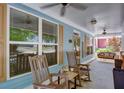 Inviting front porch with rocking chairs, ceiling fans, and views of the neighborhood at 230 Ryan Ln, Covington, GA 30014