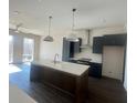 Bright kitchen with island, modern appliances and fixtures, and plenty of cabinet space at 1274 Longreen Terrace Nw # 114, Atlanta, GA 30318