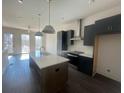 Modern kitchen with island and stainless steel appliances; perfect for cooking and entertaining at 1274 Longreen Terrace Nw # 114, Atlanta, GA 30318